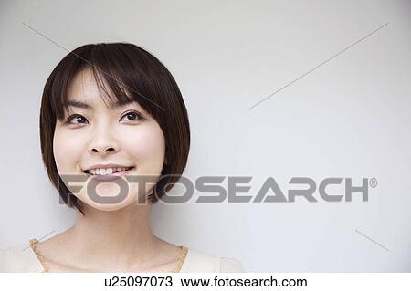 Young woman smiling View Large Photo Image Stock Image - Young woman smiling. Fotosearch