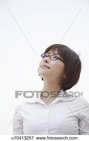 Stock Photo - Young woman with glasses. Fotosearch