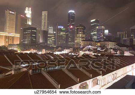 Buildings in a city lit up at night, Singapore View Large Photo Image Picture - Buildings in a city lit up at night, Singapore. Fotosearch