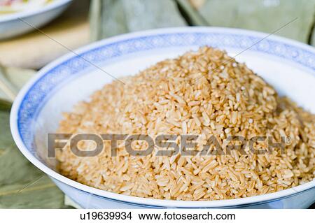Close-up of a bowl of brown rice View Large Photo Image Picture - Close-up of a bowl of brown rice. Fotosearch