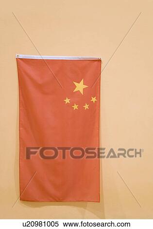 Stock Photography - Close-up of a Chinese flag hanging on the wall. Fotosearch