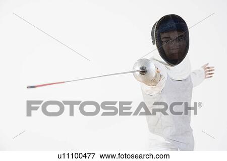 Stock Photo - Close-up of a man practicing fencing. Fotosearch