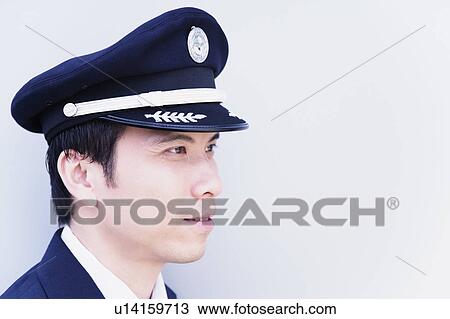 Stock Image - Close-up of a pilot looking away. Fotosearch