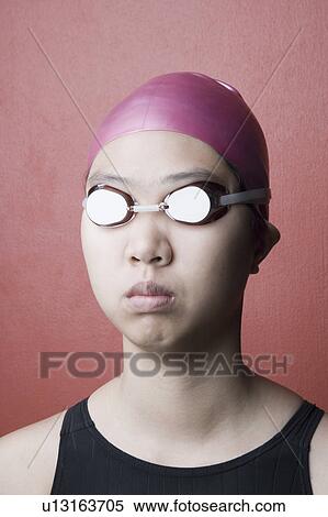 Stock Photography - Close-up of a young woman wearing swimwear. Fotosearch