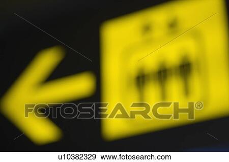 Close-up of an arrow sign at an airport View Large Photo Image Stock Photo - Close-up of an arrow sign at an airport. Fotosearch