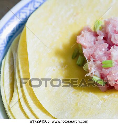 Close-up of stuffing on Chinese dumplings View Large Photo Image Stock Photography - Close-up of stuffing on Chinese dumplings. Fotosearch