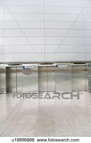 Stock Photo - Closed doors of elevators. Fotosearch
