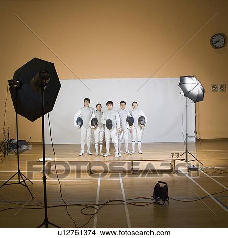 Five fencers standing side by side View Large Photo Image Picture - Five fencers standing side by side. Fotosearch
