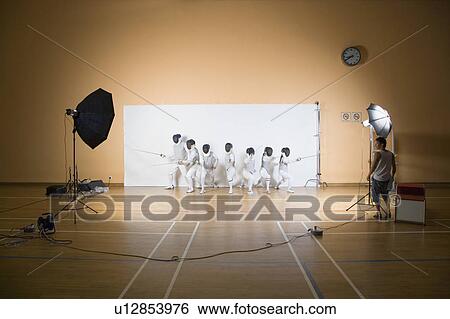 Stock Photograph - Group of people fencing. Fotosearch