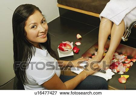 Low section view of a woman getting a pedicure View Large Photo Image Stock Photo - Low section view of a woman getting a pedicure. Fotosearch