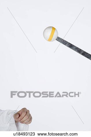 Person's hand near a sword pierced in a ball View Large Photo Image Stock Image - Person's hand near a sword pierced in a ball. Fotosearch