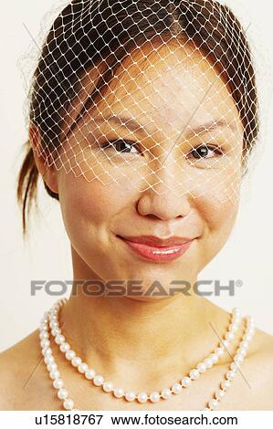 Stock Photo - Portrait of a bride grinning. Fotosearch