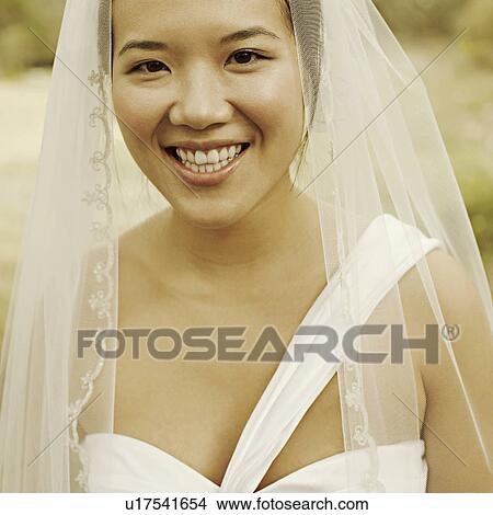 Portrait of a bride smiling View Large Photo Image Picture - Portrait of a bride smiling. Fotosearch