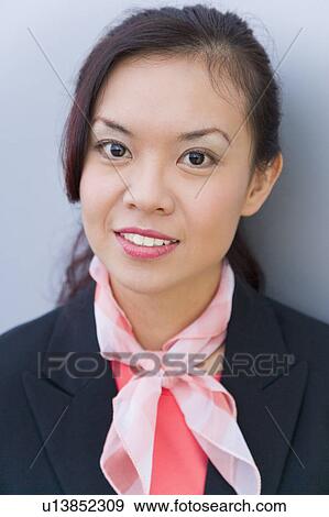 Portrait of a female cabin crew smiling View Large Photo Image Stock Photo - Portrait of a female cabin crew smiling. Fotosearch