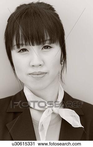 Stock Image - Portrait of a female cabin crew wearing a neckerchief. Fotosearch