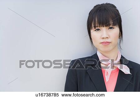 Portrait of a female cabin crew wearing a neckerchief View Large Photo Image Stock Photography - Portrait of a female cabin crew wearing a neckerchief. Fotosearch