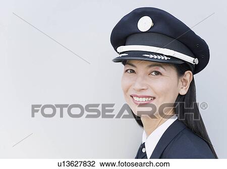Portrait of a female pilot smiling View Large Photo Image Stock Image - Portrait of a female pilot smiling. Fotosearch