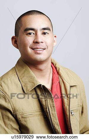 Stock Photo - Portrait of a young woman smiling. Fotosearch