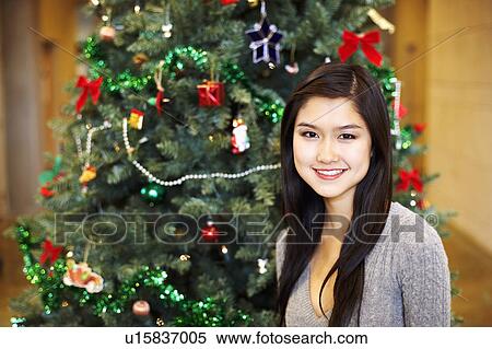 Stock Photography - Portrait of a young woman smiling. Fotosearch