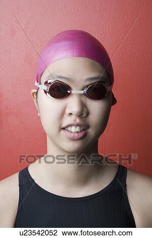 Stock Image - Portrait of a young woman wearing swimwear. Fotosearch