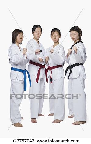 Portrait of four young women in fighting stance View Large Photo Image Stock Image - Portrait of four young women in fighting stance. Fotosearch