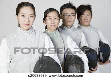 Portrait of two male and two female fencers holding fencing masks View Large Photo Image Stock Photo - Portrait of two male and two female fencers holding fencing masks. Fotosearch
