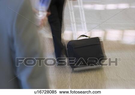 Two business executives at an airport View Large Photo Image Stock Photography - Two business executives at an airport. Fotosearch