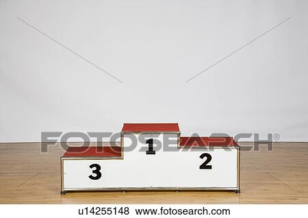 Stock Photo - Winners podium on a wood laminate flooring. Fotosearch