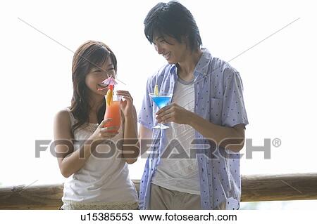 Young couple drinking cocktail, Saipan View Large Photo Image Stock Image - Young couple drinking cocktail, Saipan. Fotosearch