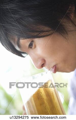 Young Man drinking beer, Saipan View Large Photo Image Stock Photography - Young Man drinking beer, Saipan. Fotosearch