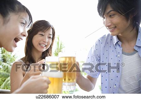 Young people toasting with beer, Saipan View Large Photo Image Stock Photo - Young people toasting with beer, Saipan. Fotosearch