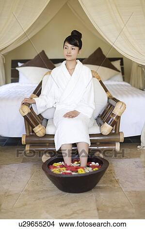 Young woman relaxing in a foot bath, Saipan, Focus on Foreground View Large Photo Image Picture - Young woman relaxing in a foot bath, Saipan, Focus on Foreground. Fotosearch