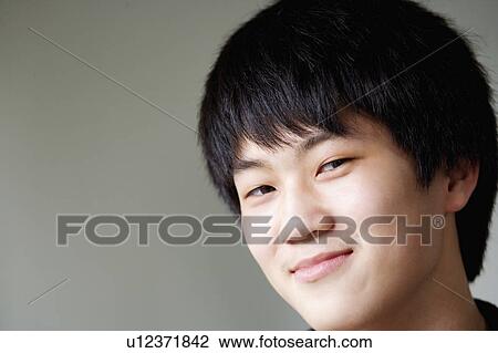 Close-up of a boy smiling View Large Photo Image Stock Image - Close-up of a boy smiling. Fotosearch