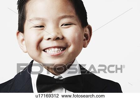 Close-up of a boy smiling View Large Photo Image Stock Image - Close-up of a boy smiling. Fotosearch