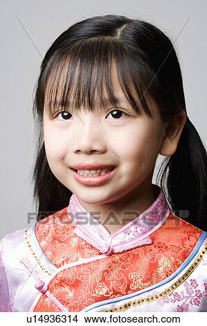 Close-up of a girl smiling View Large Photo Image Picture - Close-up of a girl smiling. Fotosearch