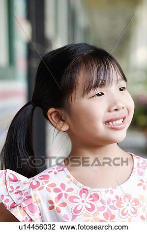 Close-up of a girl smiling View Large Photo Image Stock Image - Close-up of a girl smiling. Fotosearch