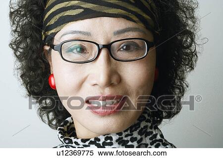 Stock Photography - Close-up of a mature woman smiling. Fotosearch