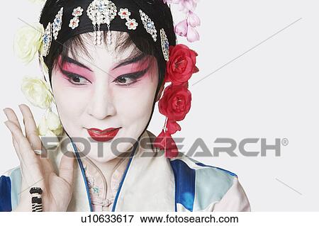 Stock Photo - Close-up of a mature woman wearing traditional clothing. Fotosearch