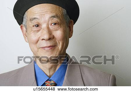 Close-up of a senior man smiling View Large Photo Image Stock Photo - Close-up of a senior man smiling. Fotosearch
