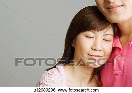 Stock Photograph - Close-up of a young couple. Fotosearch