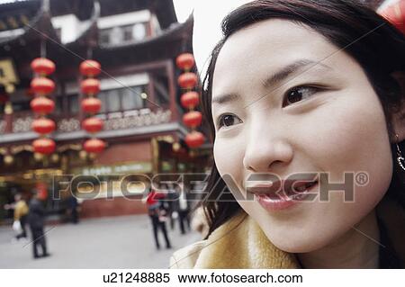 Stock Photography - Close-up of a young woman looking away. Fotosearch
