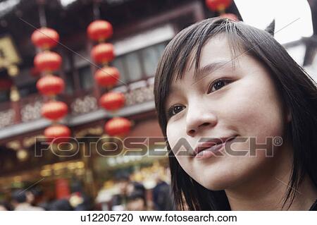 Stock Image - Close-up of a young woman smiling. Fotosearch