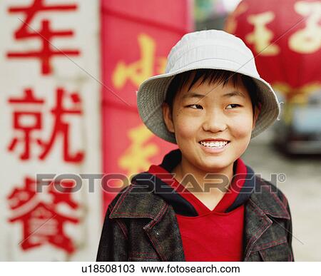 Stock Image - Close-up of a young woman smiling. Fotosearch