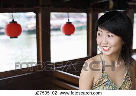 Close-up of a young woman smiling View Large Photo Image Stock Image - Close-up of a young woman smiling. Fotosearch
