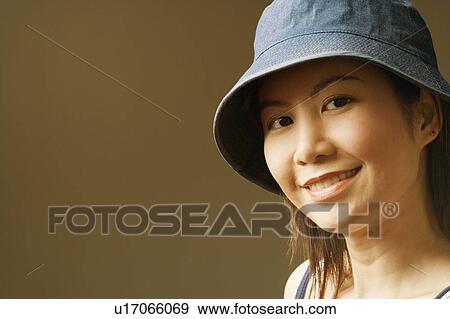 Stock Photo - Close-up of a young woman smiling. Fotosearch