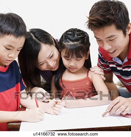 Close-up of parents teaching a boy and a girl how to color View Large Photo Image Stock Image - Close-up of parents teaching a boy and a girl how to color. Fotosearch