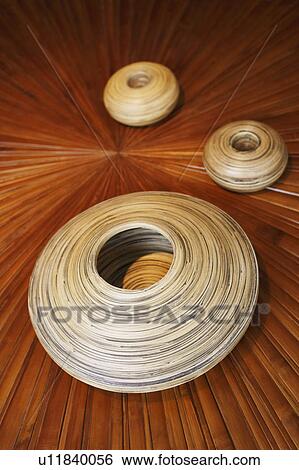 Close-up of three clay pots on a wooden base View Large Photo Image Stock Photograph - Close-up of three clay pots on a wooden base. Fotosearch