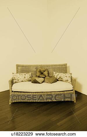 Stock Photo - High angle view of a couch at the corner of a room. Fotosearch