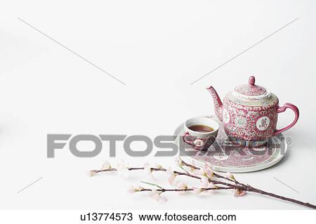 High angle view of a cup of black tea and a teapot on a tray View Large Photo Image Stock Image - High angle view of a cup of black tea and a teapot on a tray. Fotosearch