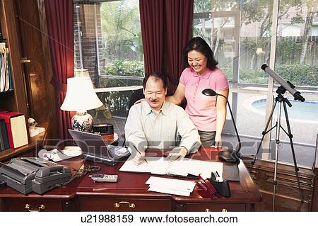 Stock Photo - High angle view of a senior man and a mature woman. Fotosearch